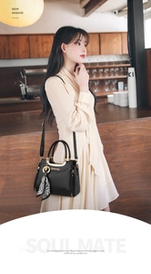 Quilted black handbag with gold hardware and leopard print scarf on model in cafe