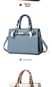 Close-up of litchi texture leather handbags with silk scarves on handles in multiple colors