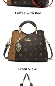 Detail of monogram leather handbag with metal round handle and leaf pendant charm