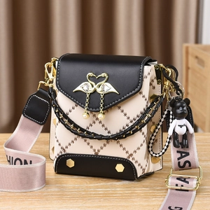 Elegant black and beige square handbag with swan clasp, pearl charm and bear pendant