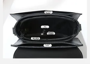 Vista interior del bolso bandolera de cuero con compartimentos y bolsillos con cremallera