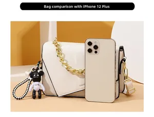Size comparison of beige leather crossbody bag with chain and iPhone 12 Plus