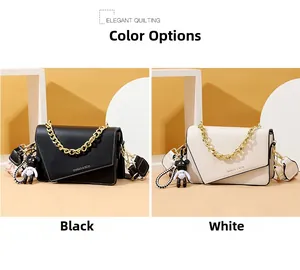 Detail of quilted flap bags in black and white with gold chains and floral straps
