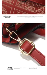 Close-up of red leather handbag showing quilted embroidery and golden hardware detail