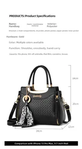 Detail of black quilted leather handbag with gold hardware and dimensions 24x20x12cm