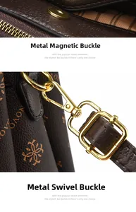 Close-up of golden magnetic clasp and swivel hook on brown patterned leather handbag