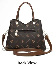 Detailed back view of a large brown vintage tote bag with elegant floral pattern and zip pocket