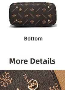 Detail view of the brown leather bag bottom featuring gold metal feet and logo print