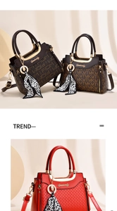 Detail of elegant handbags in coffee monogram and red quilted leather with silk scarf