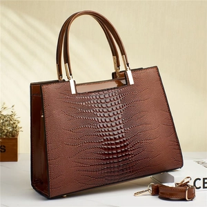 Brown faux crocodile leather tote bag with glossy finish and detachable shoulder strap