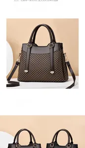 Detail of dark brown textured handbag with gold hardware and detachable shoulder strap