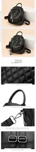 Detail view of black quilted PU leather backpack with bear charm and metallic hardware