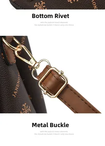 Detail view of gold-tone metal buckles and protective bottom rivets on brown leather bag