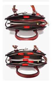Top view of red leather handbag showing multi-compartment interior and silk handle scarf