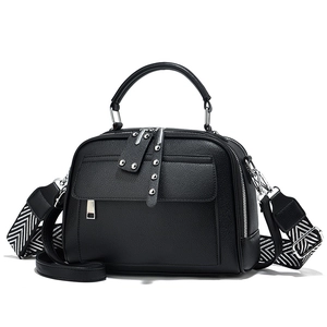 Elegant black lychee texture Boston bag with wide geometric strap and silver rivets