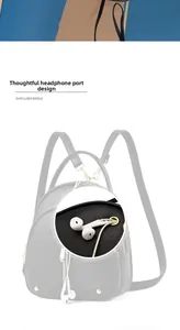 Detail of side earphone hole on black lychee pattern leather shoulder bag