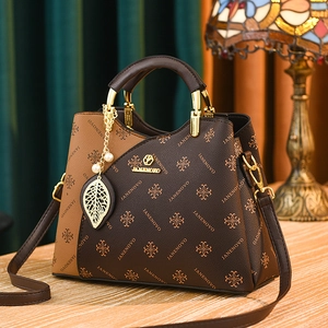Classic monogram tote bag in contrast brown with gold handles and pearl pendant detail