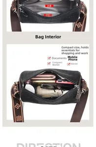 Detail view of black crocodile pattern cylinder bag interior showing high storage capacity