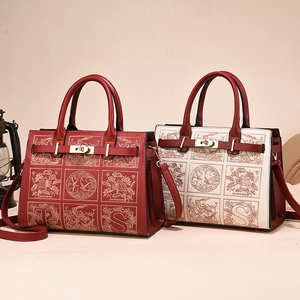 Classic red embroidered tote bag with top handle and vintage floral pattern design