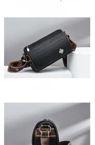 Detail of black crocodile texture bag with silver clover buckle and woven strap