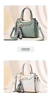 Detail of green leather handbag with diamond quilted stitching and silk leopard scarf