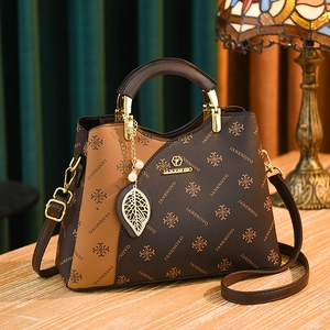 Vintage two-tone leather handbag with JANENOVO print and decorative leaf charm