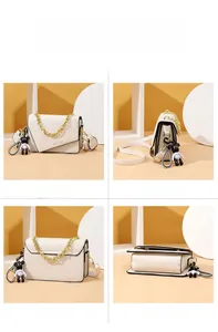 Detailed views of white PU leather crossbody bag with gold chain and black bear charm