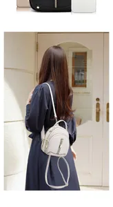 Mini cream faux leather backpack with litchi texture and golden metal rivets detail