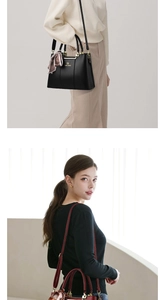 Detail of elegant tote bags in black and wine red with silk scarf and gold brand logo