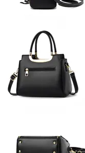 Detail view of black PU leather handbag with gold metal feet and rear zipper pocket