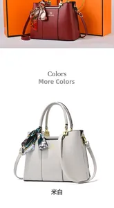 Detail view of large PU leather tote bags in red and off-white with silk scarves