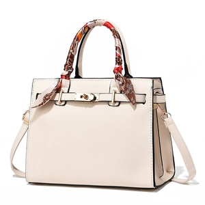 Elegant cream white trapezoid handbag with gold lock and silk scarf handle detail