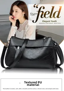 Detail of soft black PU leather texture and smooth finish of the shoulder bag