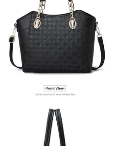 Close-up of black PU leather tote bag with gold chain strap and geometric embossed texture