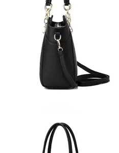 Side view of black lychee grain tote bag with gold chain and functional pocket