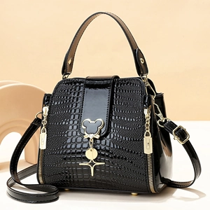 Glossy black crocodile pattern bucket bag with golden mouse charm and shoulder strap