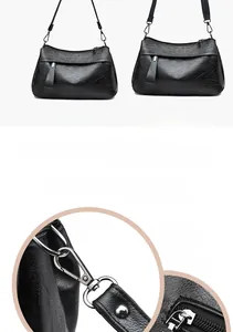 Detail of black pebbled leather bag showing shoulder, hand-carry, and crossbody styles