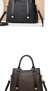 Detail of cross-hatched textured tote bags with leather handles and gold metal hardware