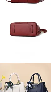 Detailed view showing leather handbag back, metal studs on base, and silk scarf detail