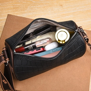 Black crocodile embossed leather bucket bag with jacquard strap and spacious interior