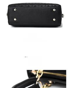 Detail view of the black pebble leather tote bottom with protective gold metal feet