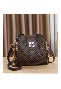 Close-up of vintage brown PU leather bag featuring a gold clover metal clasp and chain