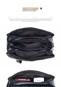 Detail view of large capacity black leather shoulder bag with multiple functional pockets