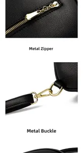 Detail of golden hardware zipper and clip on black litchi leather backpack