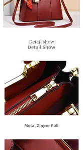 Close-up of red lychee leather texture and golden metal zippers on woman handbag
