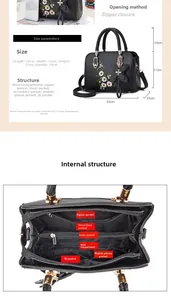 Detailed view of black faux leather handbag with floral embroidery and interior pockets