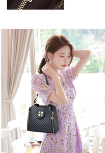 Detail of black plaid texture with gold flower clasp and side zipper on a stylish handbag