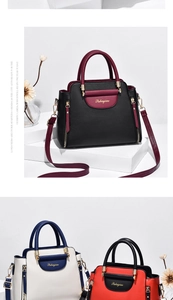 Détail du sac à main en cuir bicolore avec garnitures dorées et texture grainée