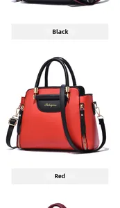 Détail du sac bicolore rouge et noir avec fermeture éclair dorée et logo Pahajim