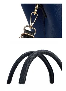 Détail de sac à main en cuir bleu marine avec ferrures dorées polies et poignée robuste